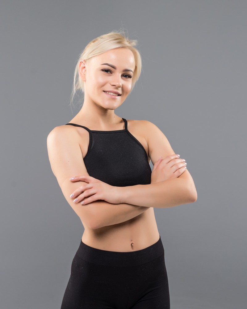 young-blonde-fit-sporty-girl-woman-black-sportswear-demostrate-her-strong-muscular-body-stretching-1